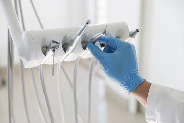 Professional Tooth Extraction technician working in Oliver County County, ND